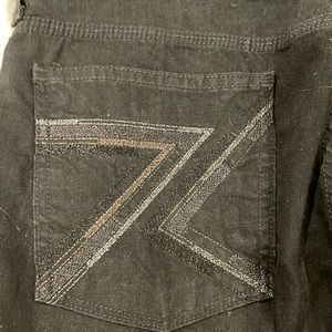 Black flare jean with decorative 7 pocket
